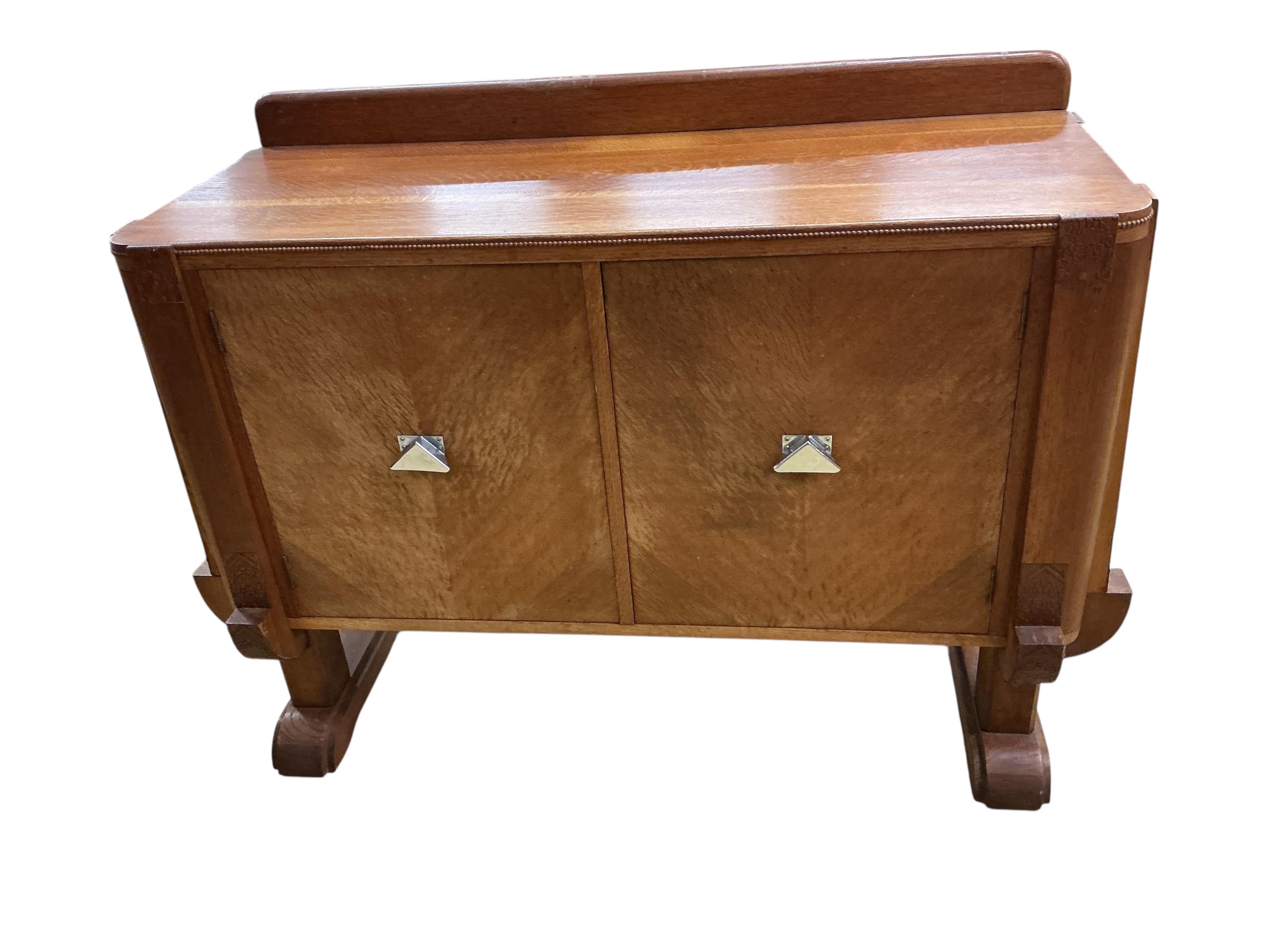 An Art Deco oak sideboard, width 134cm, depth 53cm, height 100cm